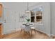 Bright breakfast nook with white table and chairs, offering ample natural light at 7620 Rolling Meadows Ln, Huntersville, NC 28078