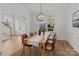 Dining room with light wood table and chandelier at 7620 Rolling Meadows Ln, Huntersville, NC 28078