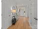 Bright foyer with hardwood floors and console table at 7620 Rolling Meadows Ln, Huntersville, NC 28078