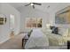 Main bedroom with large window, ceiling fan, and ensuite bathroom at 7620 Rolling Meadows Ln, Huntersville, NC 28078