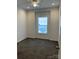 Cozy bedroom with gray carpet, a ceiling fan, and natural light at 823 Wellwood Ave, Statesville, NC 28677