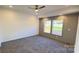 Spacious bedroom with carpeted floor, ceiling fan and a view of the outside at 823 Wellwood Ave, Statesville, NC 28677