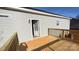 New wood deck features modern railing, exterior lighting, and access door to the home's outdoor spaces at 823 Wellwood Ave, Statesville, NC 28677