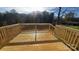 Picture of a newly constructed wooden deck with railings on a sunny day, adding outdoor living space at 823 Wellwood Ave, Statesville, NC 28677