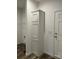 Hallway featuring a tall storage cabinet, and a door leading to another room at 823 Wellwood Ave, Statesville, NC 28677