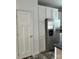 View of the kitchen featuring stainless steel refrigerator and white cabinets at 823 Wellwood Ave, Statesville, NC 28677