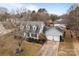 Aerial view showing a two-story house, driveway, and backyard at 841 Deerfield Dr, Mount Holly, NC 28120