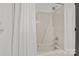 Simple bathroom with tub shower and white fixtures at 841 Deerfield Dr, Mount Holly, NC 28120