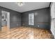 Formal dining room with dark gray walls and hardwood floors at 841 Deerfield Dr, Mount Holly, NC 28120