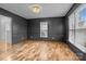 Spacious dining room with hardwood floors and gray walls at 841 Deerfield Dr, Mount Holly, NC 28120