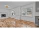 Living room with hardwood floors, fireplace and kitchen view at 841 Deerfield Dr, Mount Holly, NC 28120