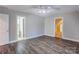 Bright bedroom with wood-look floors, ceiling fan and bathroom access at 8622 Lower Rocky River Rd, Concord, NC 28025