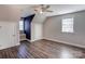 Spacious bedroom with wood-look floors, ceiling fan and window at 8622 Lower Rocky River Rd, Concord, NC 28025