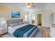 Serene bedroom with a plush bed, natural light, and access to the closet and bathroom, ideal for relaxation at 8622 Lower Rocky River Rd, Concord, NC 28025