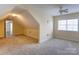 Bonus room with carpeted floor, vaulted ceiling and access to other rooms at 8622 Lower Rocky River Rd, Concord, NC 28025