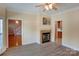 Dining room features a fireplace, hardwood floors and access to kitchen at 8622 Lower Rocky River Rd, Concord, NC 28025