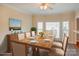 Inviting dining room with natural light, wood table and seating for six, ideal for Gathering meals and gatherings at 8622 Lower Rocky River Rd, Concord, NC 28025