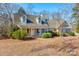 House exterior featuring a two-story home with a covered porch and landscaped yard at 8622 Lower Rocky River Rd, Concord, NC 28025