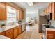 Well-lit kitchen features modern appliances, ample counter space, and a view of the dining area, great for cooking at 8622 Lower Rocky River Rd, Concord, NC 28025