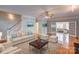 Spacious living room showcasing hardwood floors, comfortable seating, and elegant decor, perfect for gatherings at 8622 Lower Rocky River Rd, Concord, NC 28025