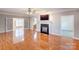 Spacious living room with hardwood floors, fireplace and lots of natural light at 8622 Lower Rocky River Rd, Concord, NC 28025