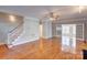 Hardwood floors, fireplace, and French doors leading to another room at 8622 Lower Rocky River Rd, Concord, NC 28025