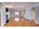 Bright living room with hardwood floors, fireplace and staircase at 8622 Lower Rocky River Rd, Concord, NC 28025