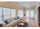 Bright sunroom with ample windows, tile floors, and comfortable seating, perfect for relaxing and entertaining at 8622 Lower Rocky River Rd, Concord, NC 28025