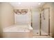 Bathroom with soaking tub, shower, and updated vanity at 8804 Ferngrove Ct, Waxhaw, NC 28173