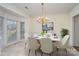 Formal dining room with chandelier and bay window at 8804 Ferngrove Ct, Waxhaw, NC 28173