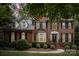 Brick home with black shutters, landscaping, and a walkway, nighttime view at 8804 Ferngrove Ct, Waxhaw, NC 28173