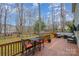 Relaxing back deck with a dining set, comfortable seating and view of the beautiful backyard at 9230 Windygap Rd, Charlotte, NC 28278