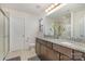 Bathroom with double sinks, granite counters, and a glass-enclosed shower for a luxurious feel at 9230 Windygap Rd, Charlotte, NC 28278