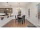 The dining room with a view into kitchen with counter seating at 9230 Windygap Rd, Charlotte, NC 28278