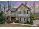 Charming two-story home featuring a mix of siding, brick, and tasteful landscaping at 9230 Windygap Rd, Charlotte, NC 28278