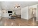 Open concept living room with a fireplace, kitchen, and view into dining area at 9230 Windygap Rd, Charlotte, NC 28278