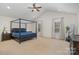 Large main bedroom features a vaulted ceiling, neutral carpet, and space for a seating area at 9230 Windygap Rd, Charlotte, NC 28278