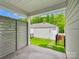 Patio view of fenced-in backyard and detached garage at 10119 Mamillion Dr, Huntersville, NC 28078
