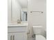 Modern bathroom features a single sink vanity with white cabinets and gold fixtures at 10119 Mamillion Dr, Huntersville, NC 28078