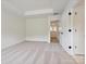 Bedroom features neutral carpet, ample natural light, and ensuite bathroom access at 10119 Mamillion Dr, Huntersville, NC 28078