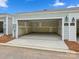 Spacious two-car garage providing ample parking and storage with access door at the back at 10119 Mamillion Dr, Huntersville, NC 28078