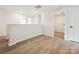 Hallway with wood floors and multiple doors to various rooms at 10119 Mamillion Dr, Huntersville, NC 28078