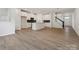 Open concept living and kitchen area featuring a kitchen island, and staircase to the next level at 10119 Mamillion Dr, Huntersville, NC 28078