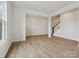 Spacious living room featuring neutral walls, light wood floors, and plenty of natural light at 10119 Mamillion Dr, Huntersville, NC 28078
