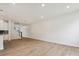 Bright living room featuring wood floors, modern lighting, and staircase to the next level at 10119 Mamillion Dr, Huntersville, NC 28078