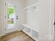 Mud room with built in storage, bench and door to the exterior yard at 10119 Mamillion Dr, Huntersville, NC 28078