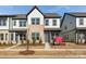 Modern townhome exterior with gray siding and landscaping at 1182 Lost Cove Rd, Indian Land, SC 29707