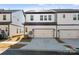 Townhouse exterior with a two-car garage and neutral color scheme at 1182 Lost Cove Rd, Indian Land, SC 29707