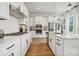 Modern white kitchen with stainless steel appliances at 1182 Lost Cove Rd, Indian Land, SC 29707