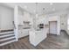 Modern kitchen with white cabinets, quartz countertops, and island at 1182 Lost Cove Rd, Indian Land, SC 29707